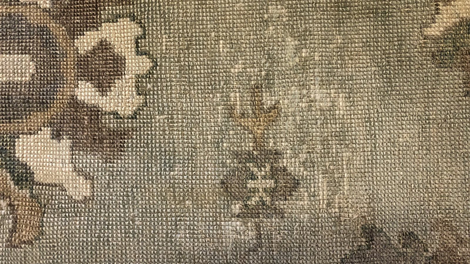 Extreme close view of individual knots and the cotton foundation