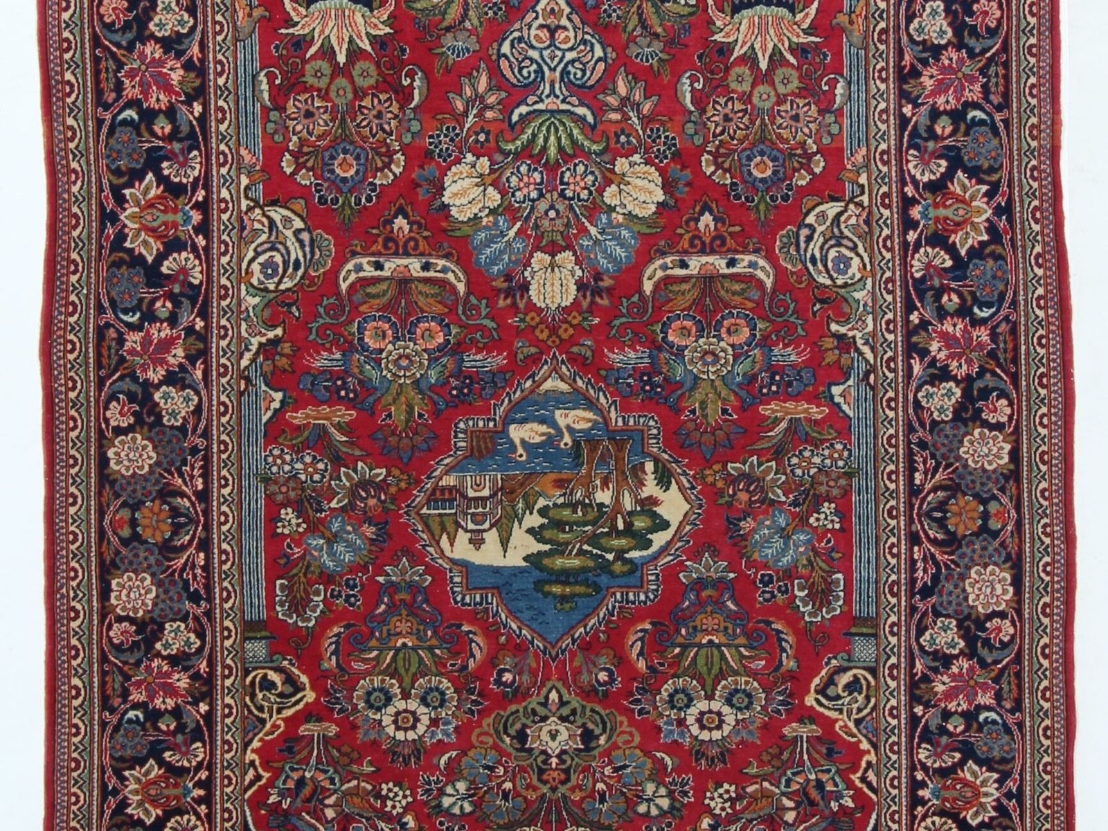 Antique Persian Kashan rug with a central medallion and dense floral field